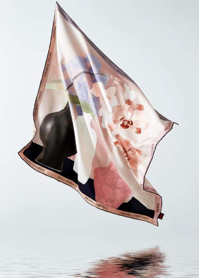 Premium silk fabric flowing in water representing JIHOO's quality and elegance